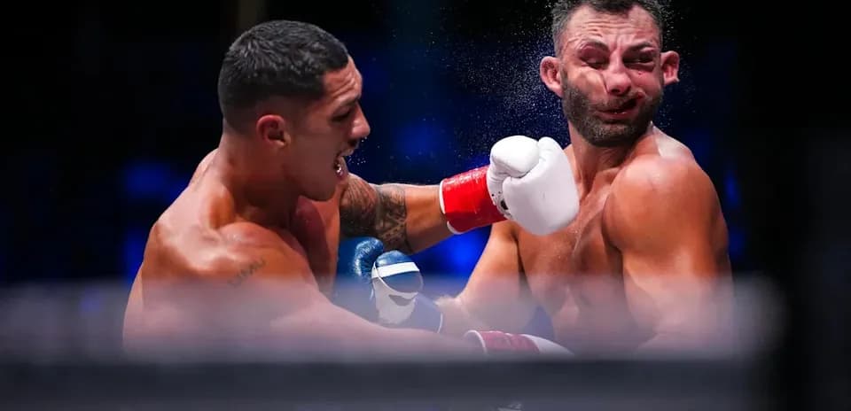 Boxers exchanging punches during a match