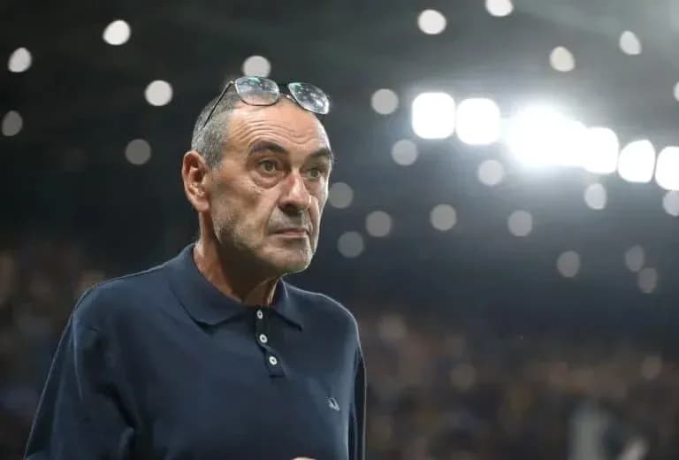 Coach observing the match from the sidelines