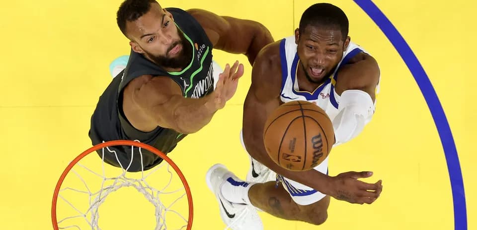 Player shooting the ball with defender nearby