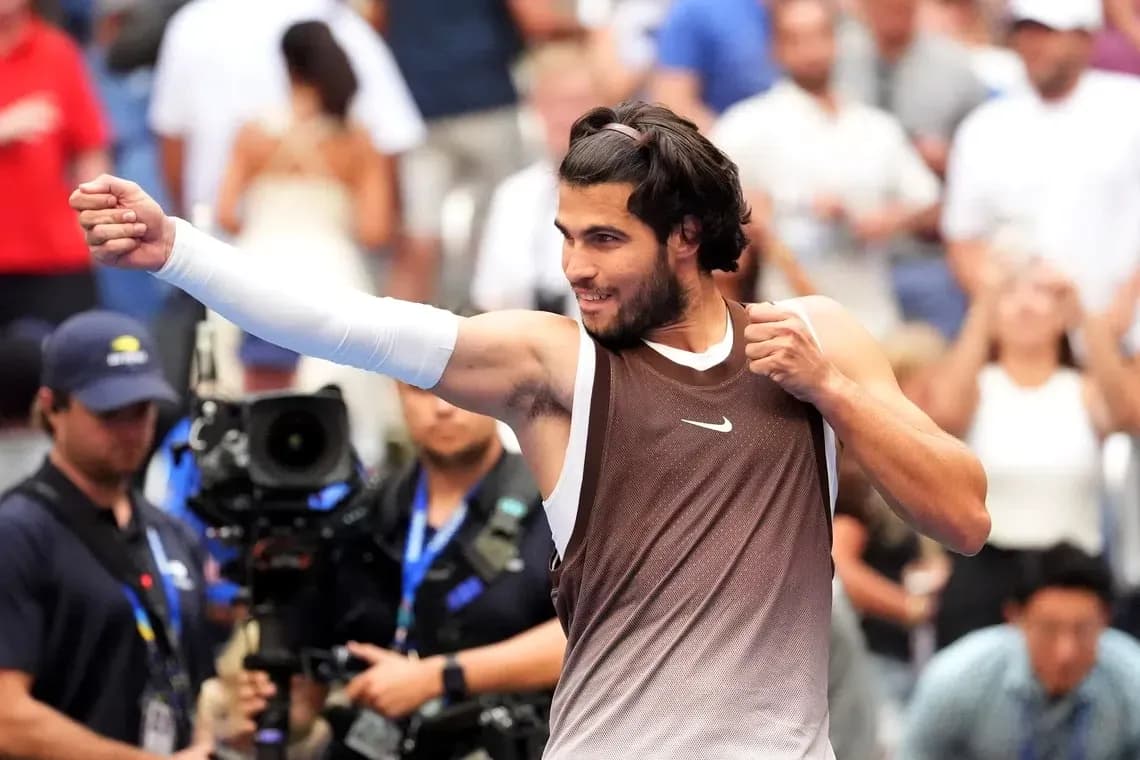 Tennis player celebrating victory with raised fist