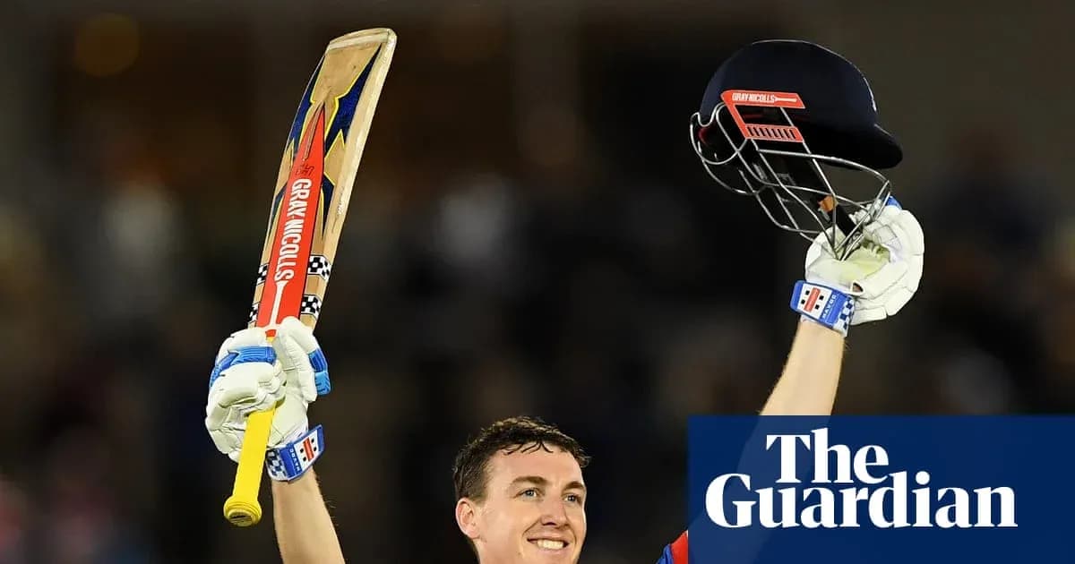 Cricketer celebrating with bat and helmet raised