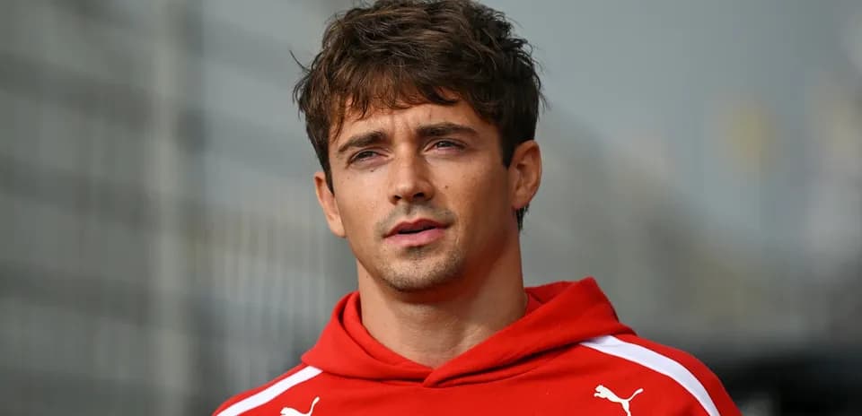 Athlete wearing red hoodie during event preparation