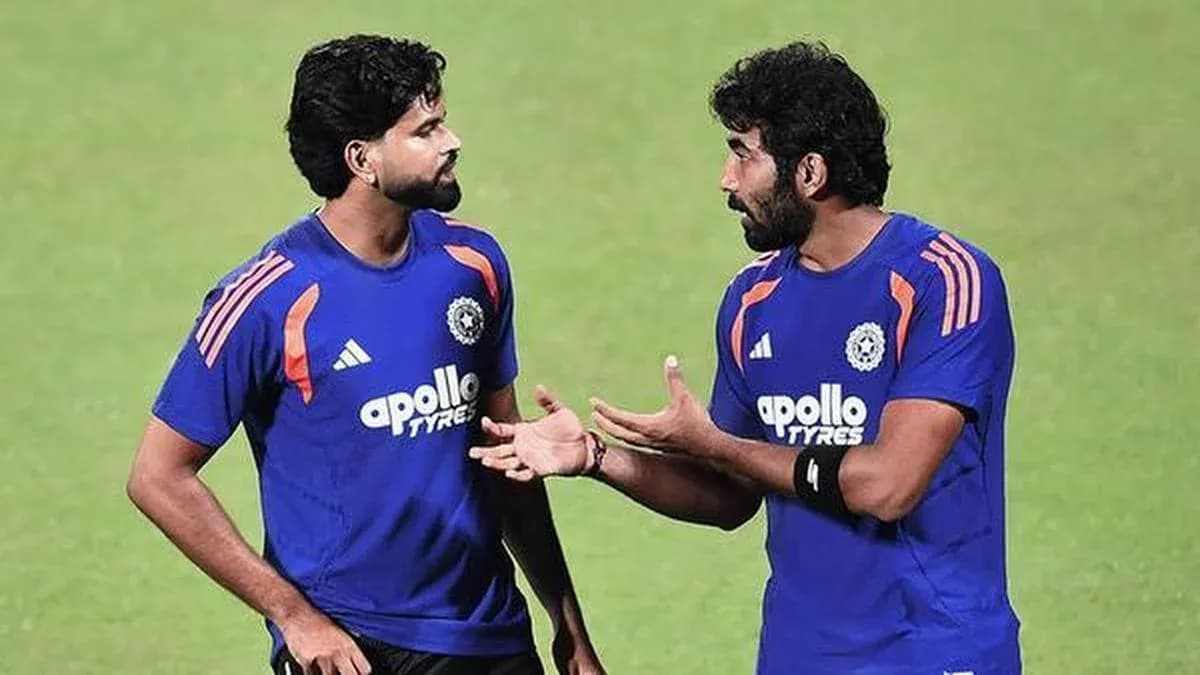 Two players discussing during training session Two players discussing during training session