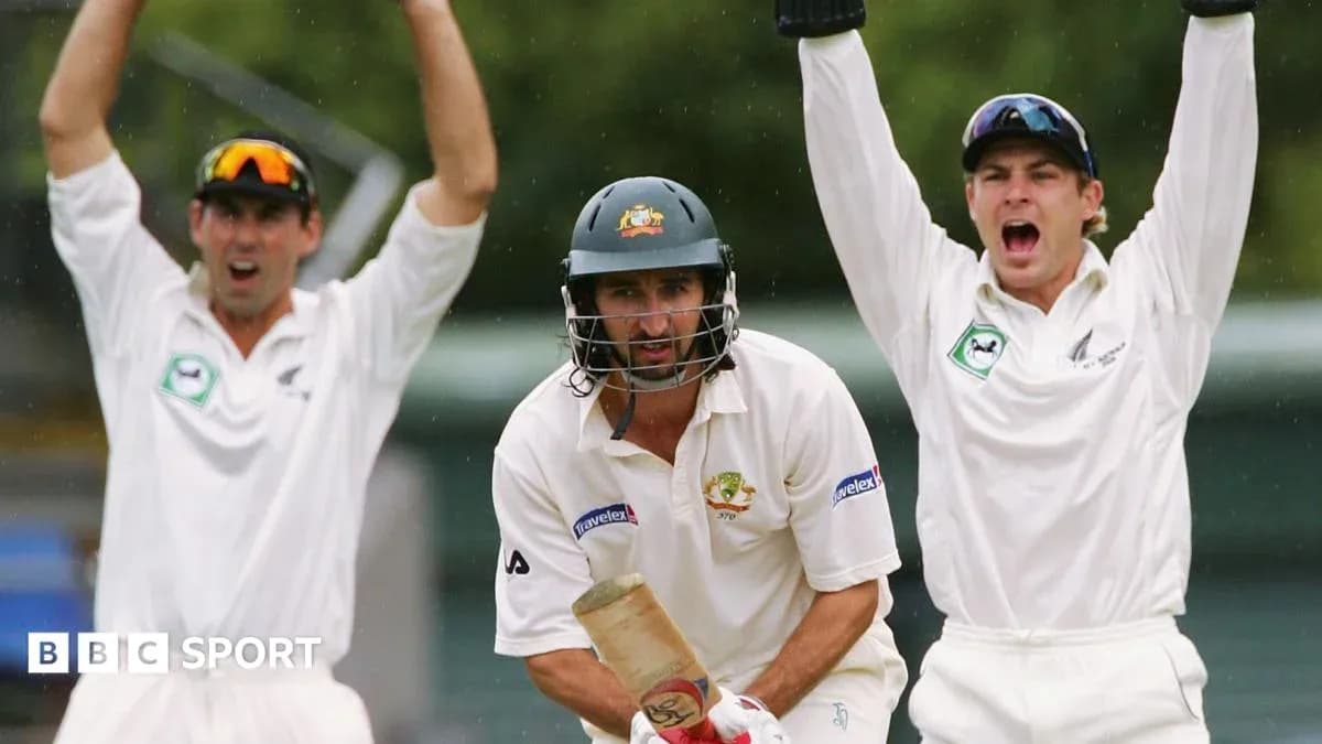 Batsman facing bowlers celebrating a wicket appeal