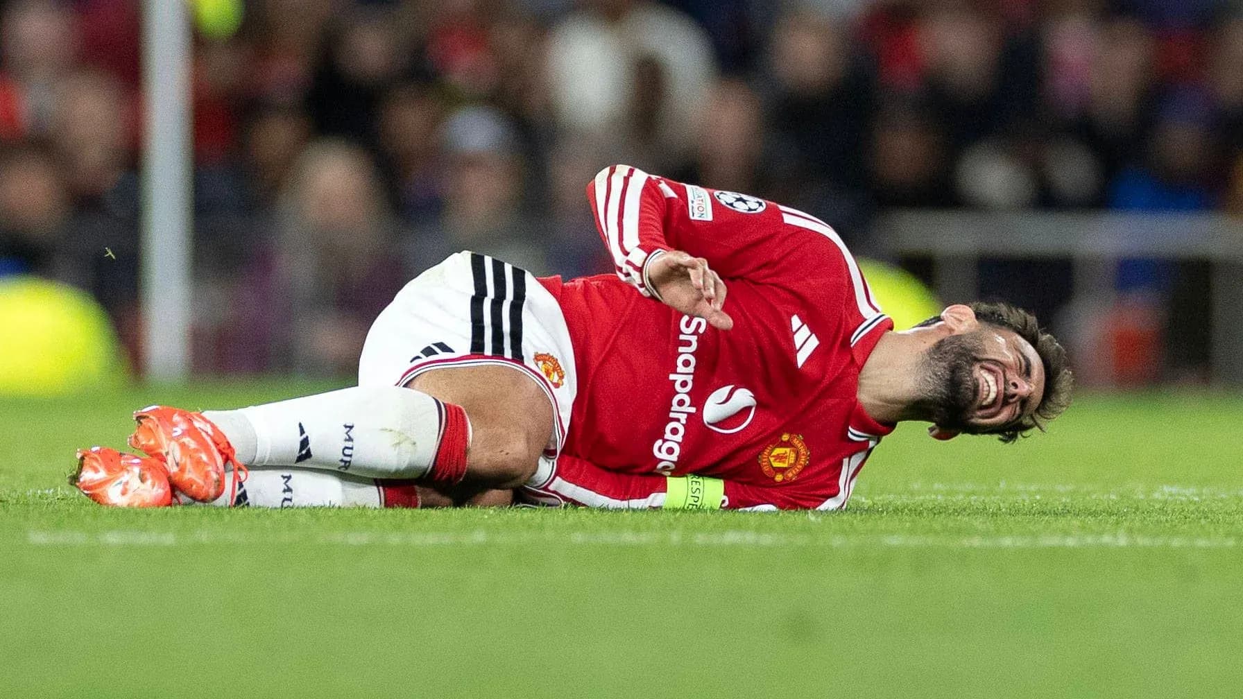 Player lying on the ground in pain during match
