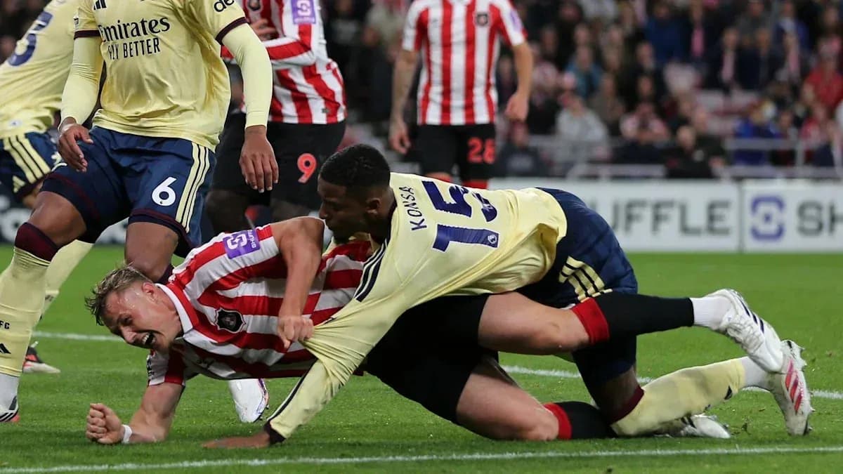 Players tangled on the ground during match action