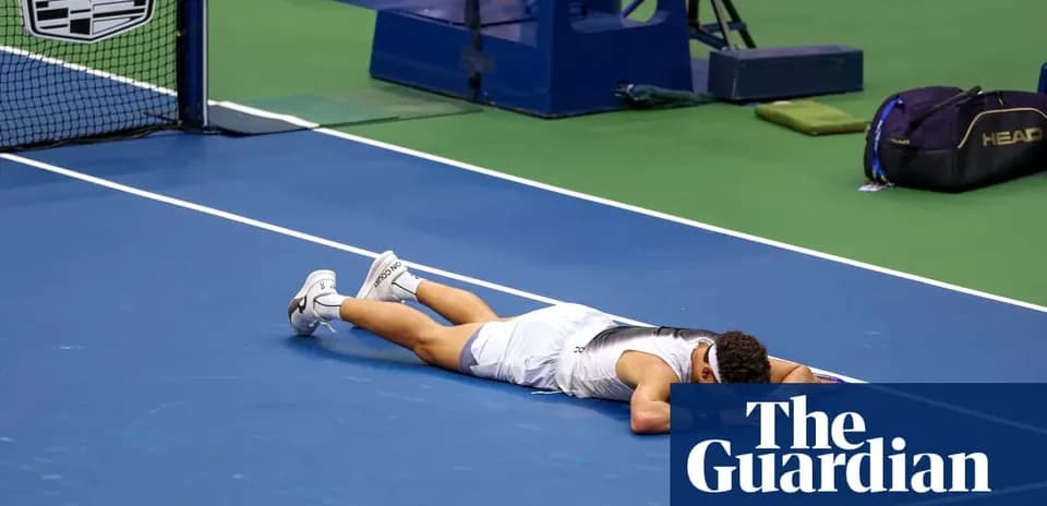 Player lying on tennis court after match