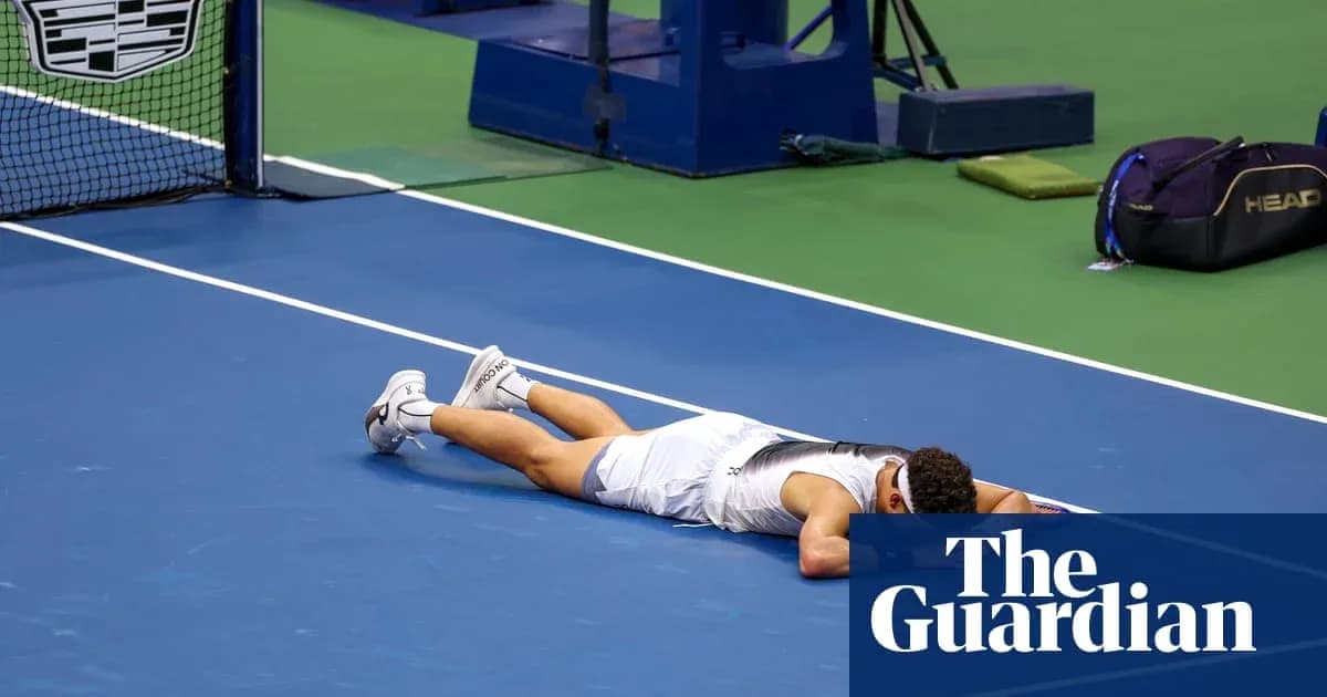 Player lying on tennis court after match