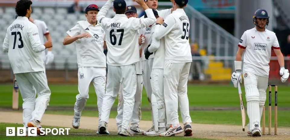 Cricket team celebrating a wicket during match