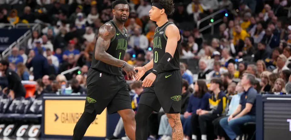 Two players celebrating during a basketball game