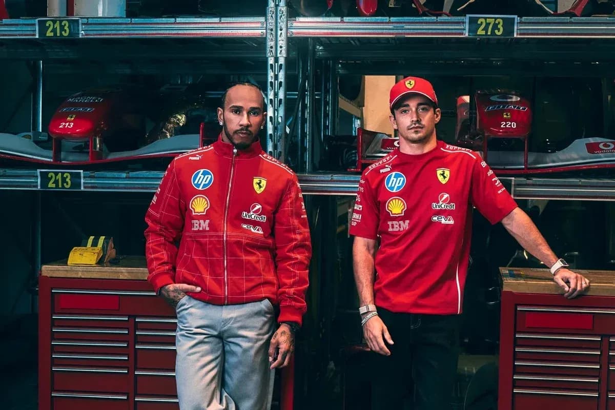 Two drivers in Ferrari team uniforms posing together Two drivers in Ferrari team uniforms posing together