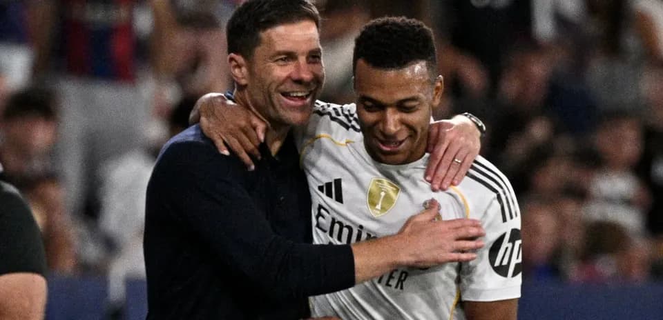 Coach and player celebrating together after match