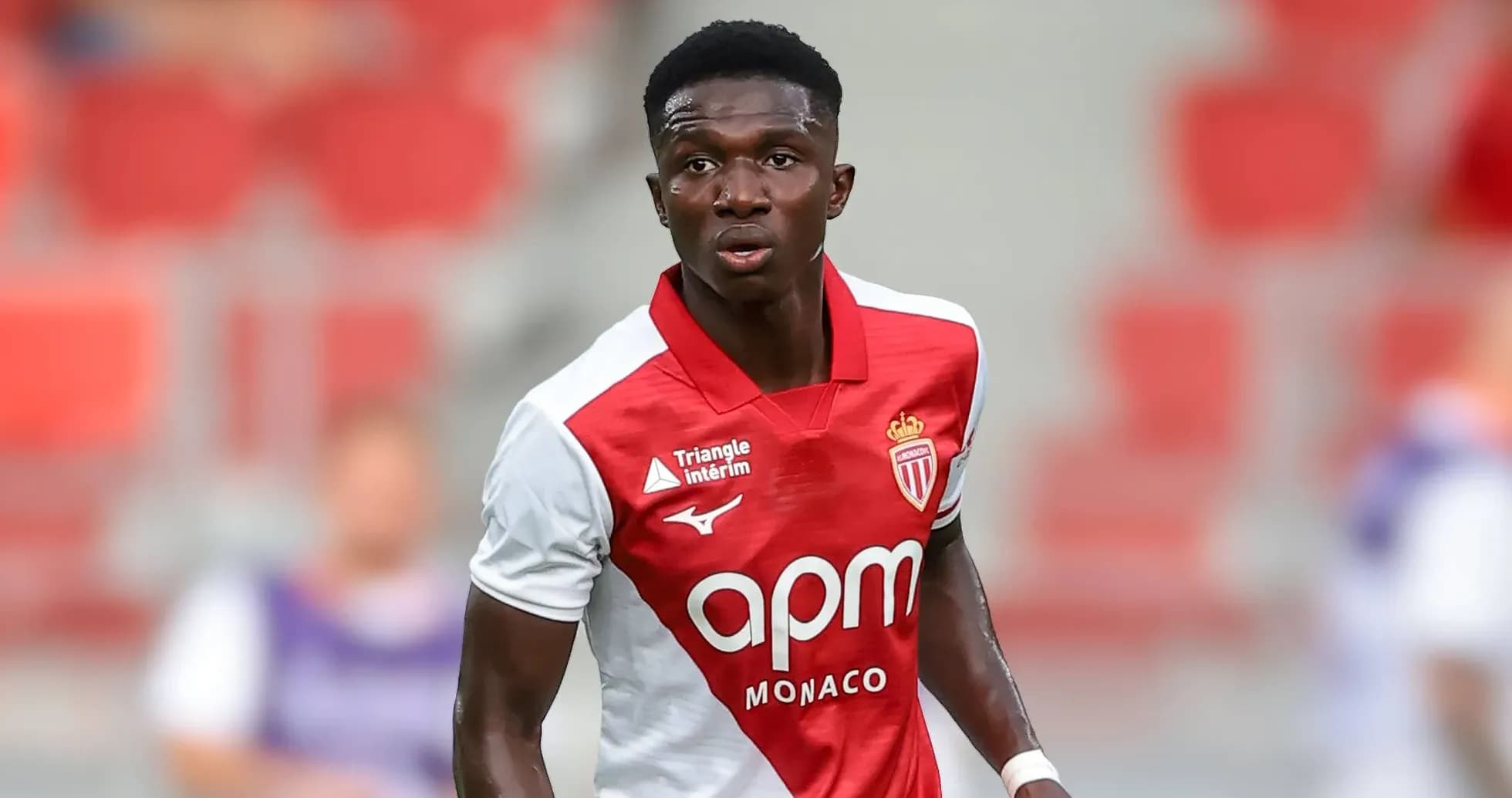 Monaco player in red and white jersey on field