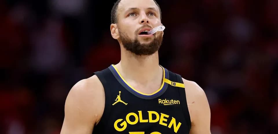 Player in Golden State jersey looking up during game