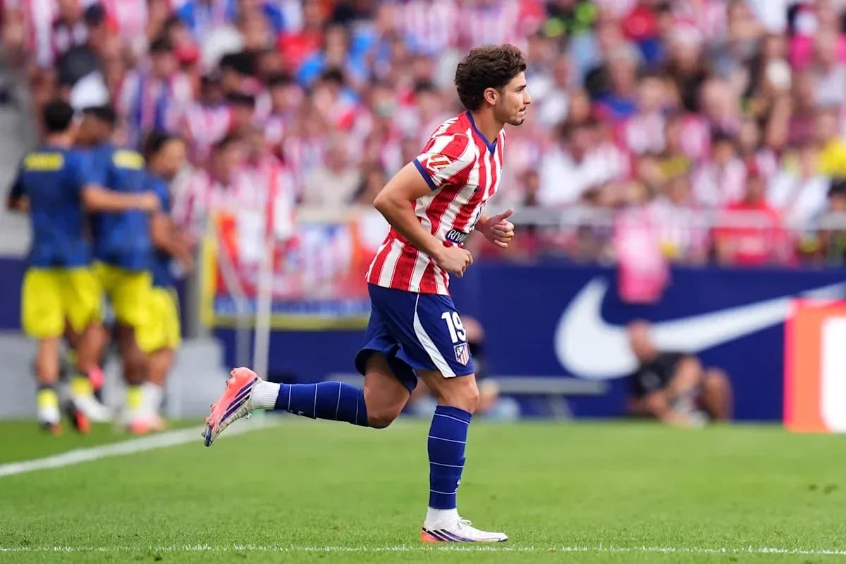 Atletico Madrid player running on the field