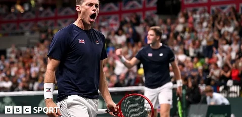 Player celebrating during a tennis match with crowd