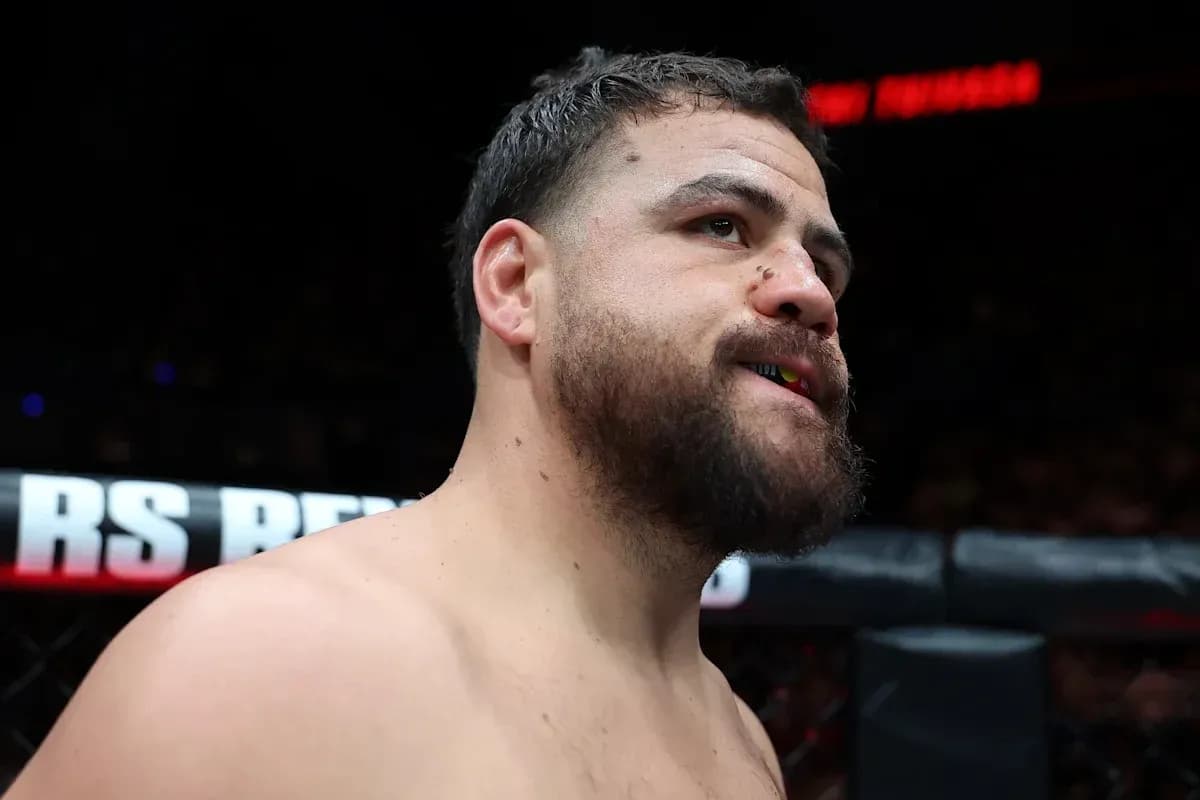 Fighter with mouthguard in MMA cage before match