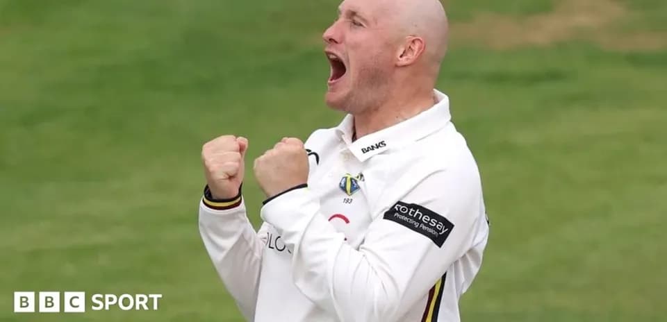 Cricketer celebrating a wicket on the field