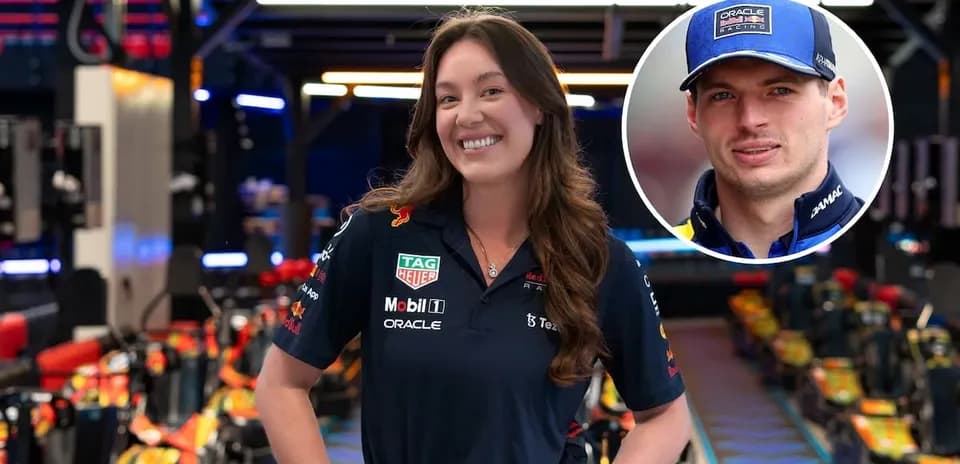 Team member in Red Bull Racing garage smiling