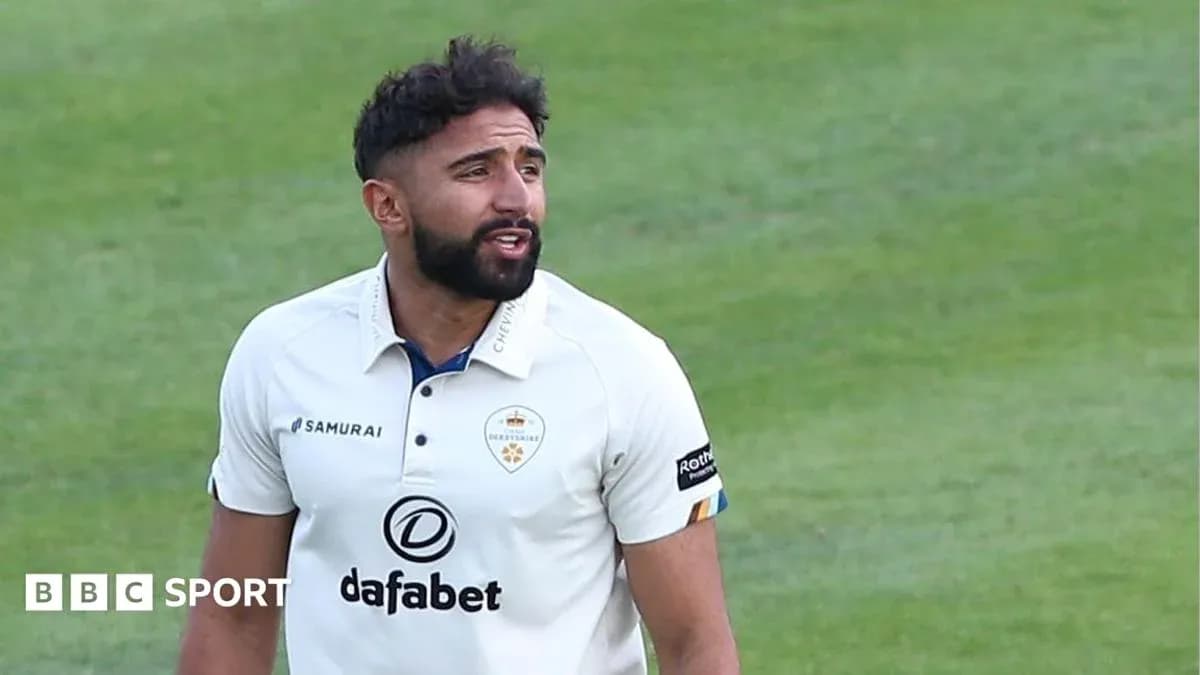 Cricketer in white kit on the field