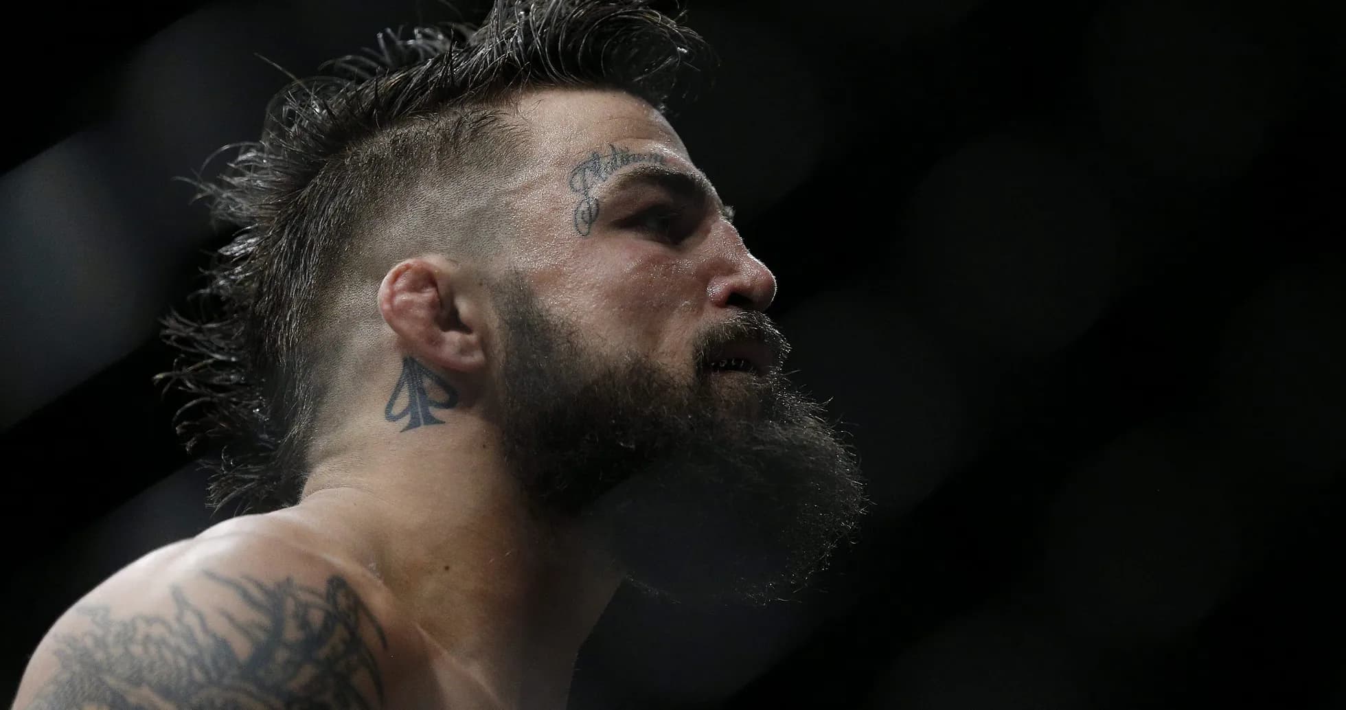Close-up of fighter with tattoos and beard