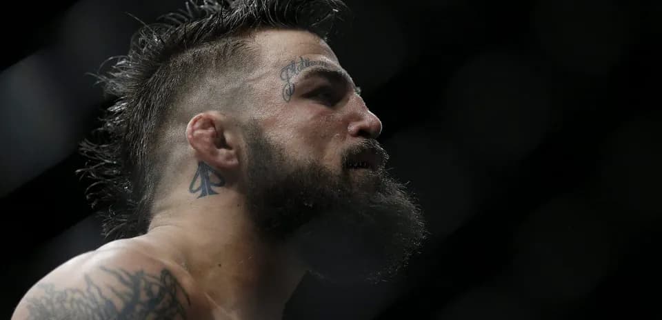 Close-up of fighter with tattoos and beard
