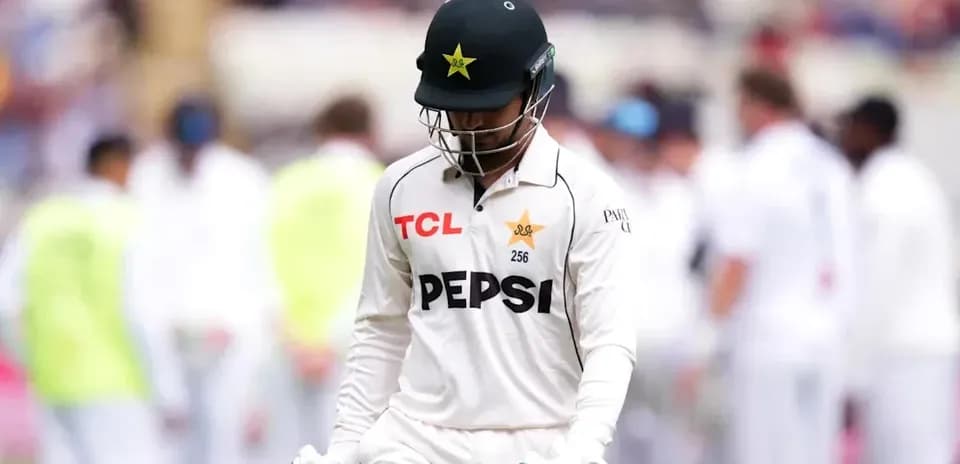 Cricketer walking off field after dismissal