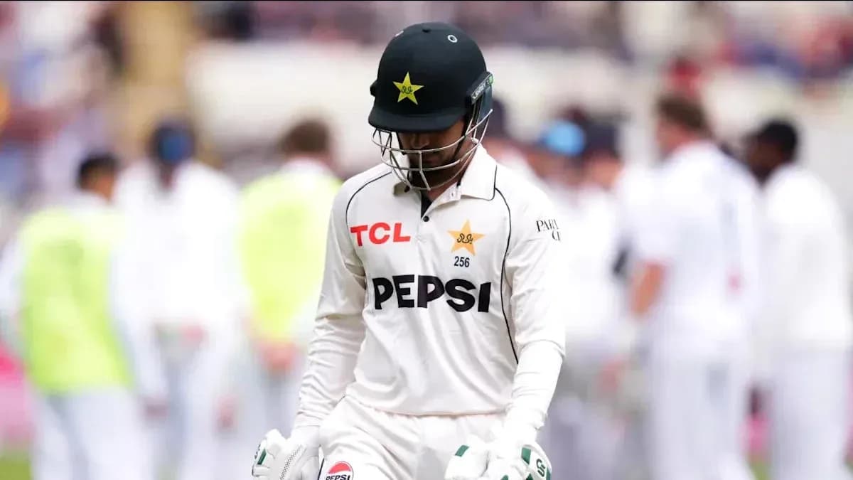 Cricketer walking off field after dismissal