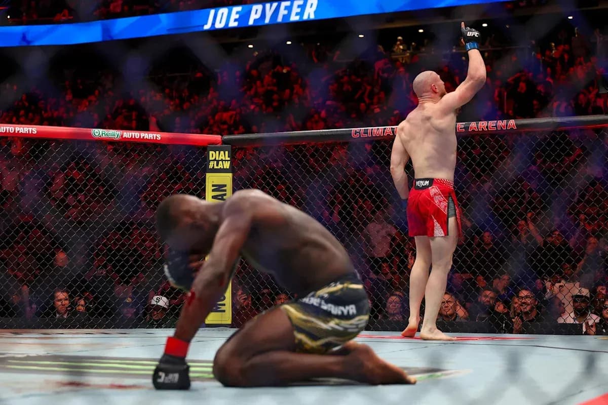 Joe Pyfer celebrating victory over opponent in octagon