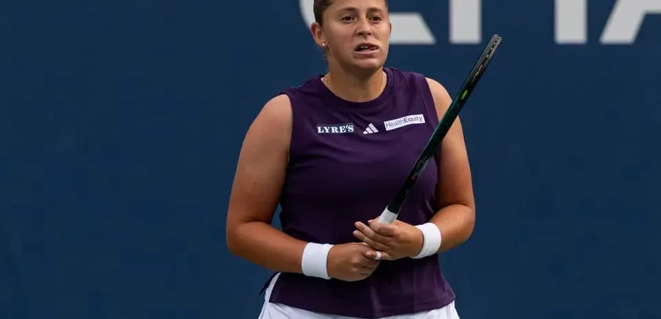 Tennis player holding racket during match preparation
