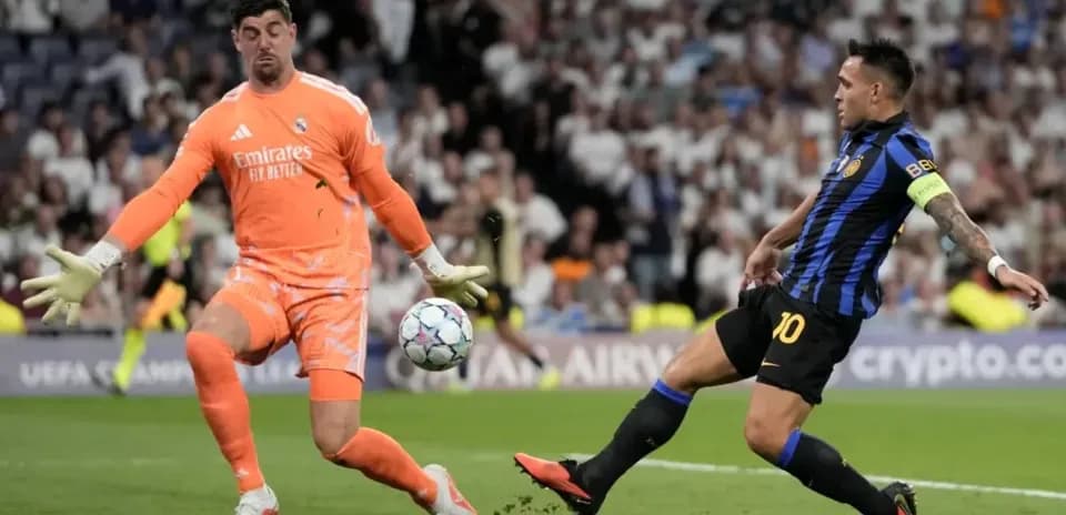 Goalkeeper blocking a shot during UEFA match