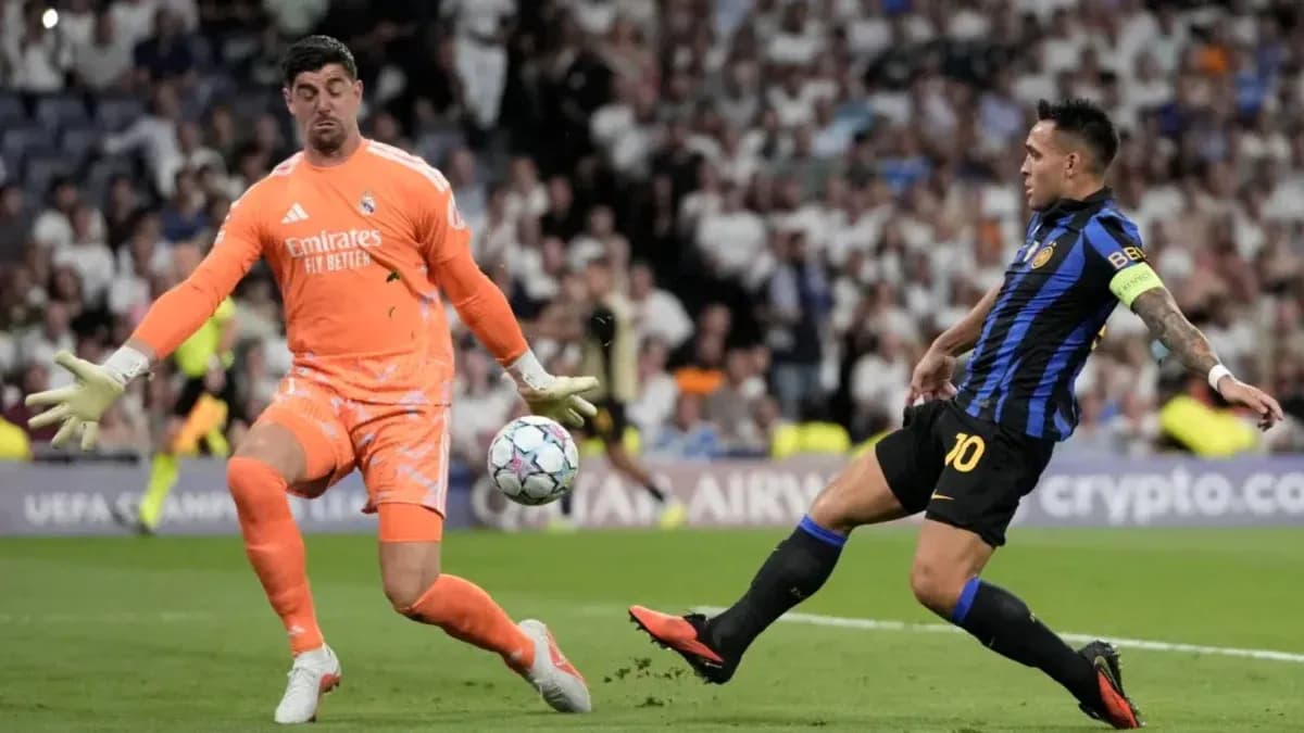 Goalkeeper blocking a shot during UEFA match