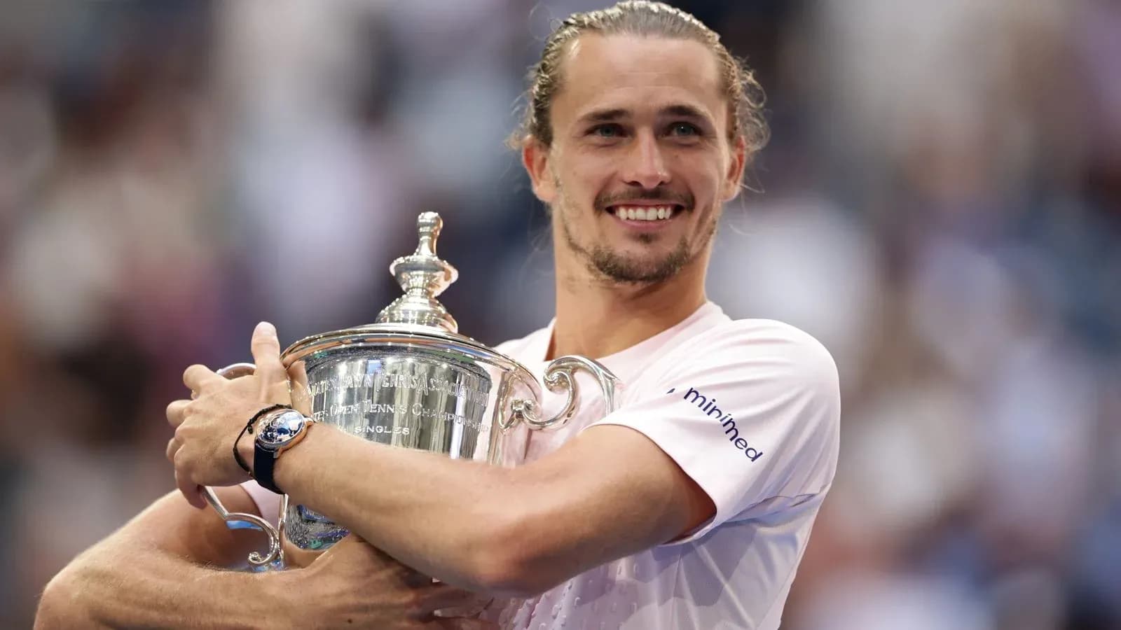 Player holding trophy after winning championship match