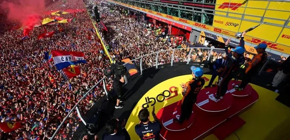 Podium celebration with fans at racing event