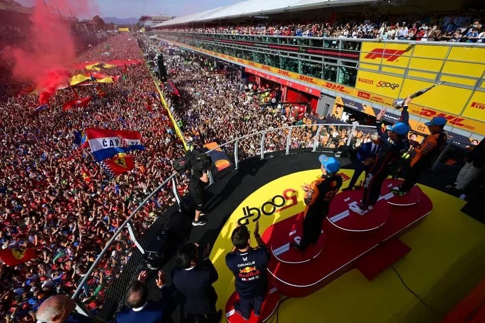 Podium celebration with fans at racing event