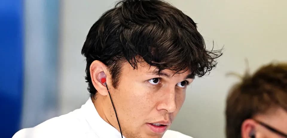 Driver wearing earphones during a briefing session