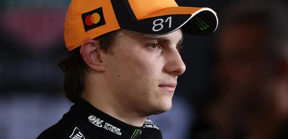Driver wearing a cap during a press event