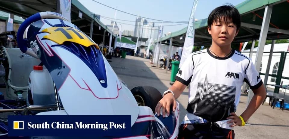 Young driver standing next to a go-kart