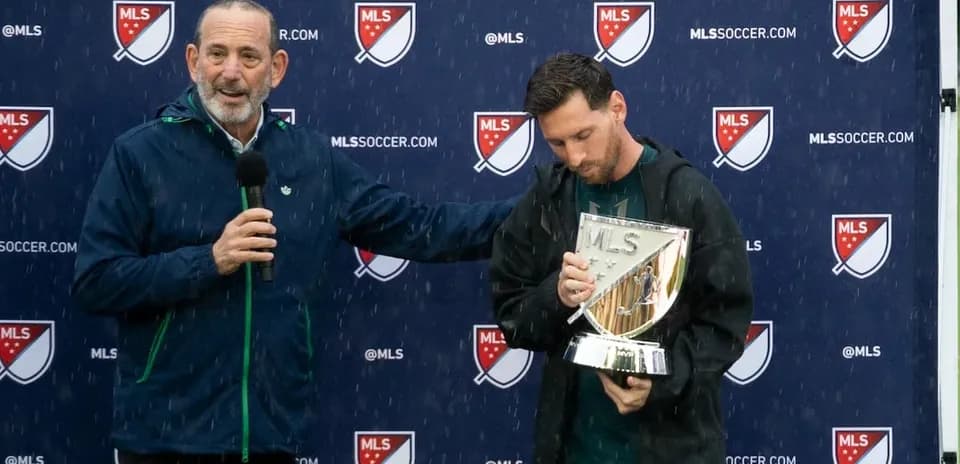 Official presenting trophy to player during ceremony