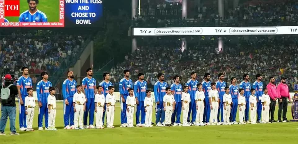Cricket team standing with children before the match