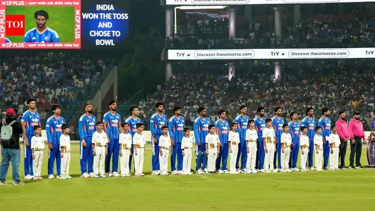 Cricket team standing with children before the match
