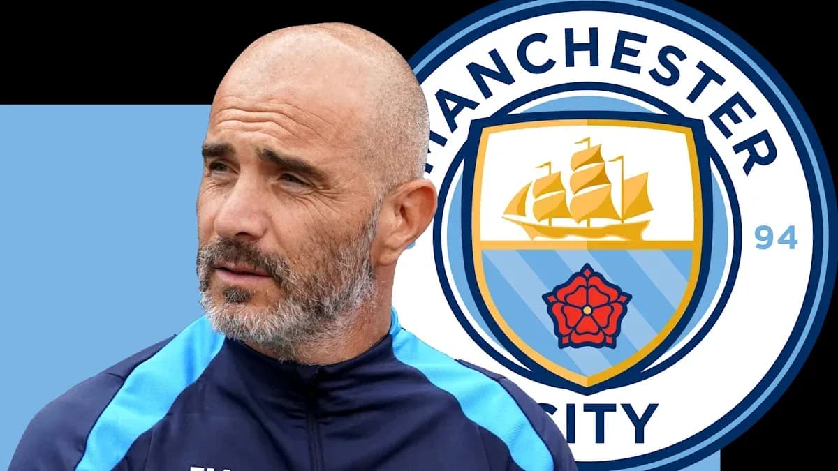 Coach next to Manchester City club logo