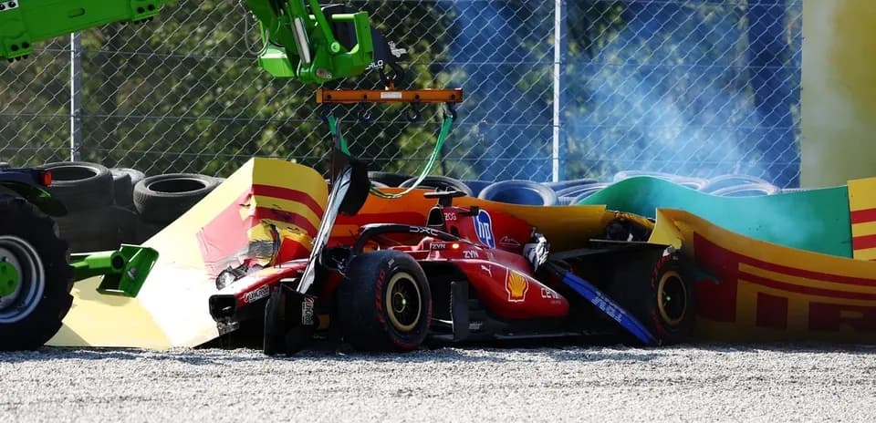 Crashed Ferrari car being lifted by recovery vehicle