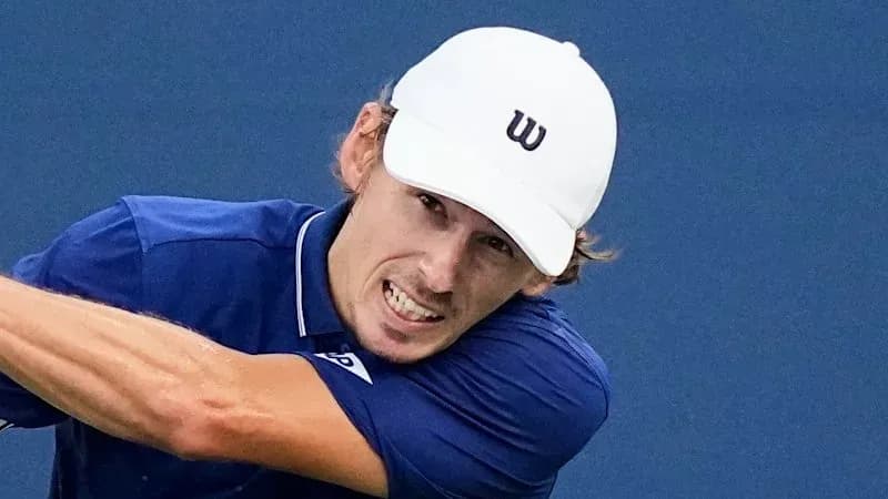 Tennis player hitting a forehand shot during match