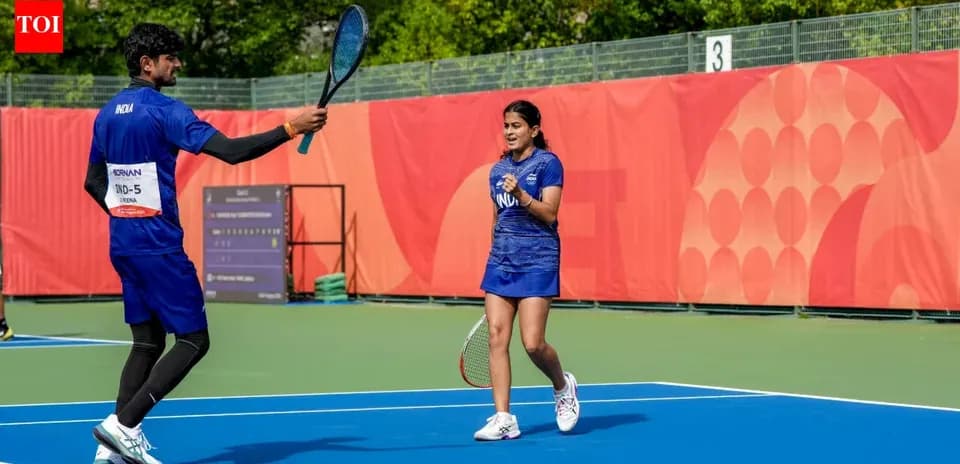 Two tennis players celebrating on court together