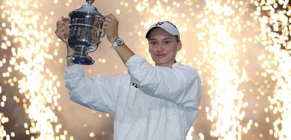 Player celebrating with trophy amidst fireworks
