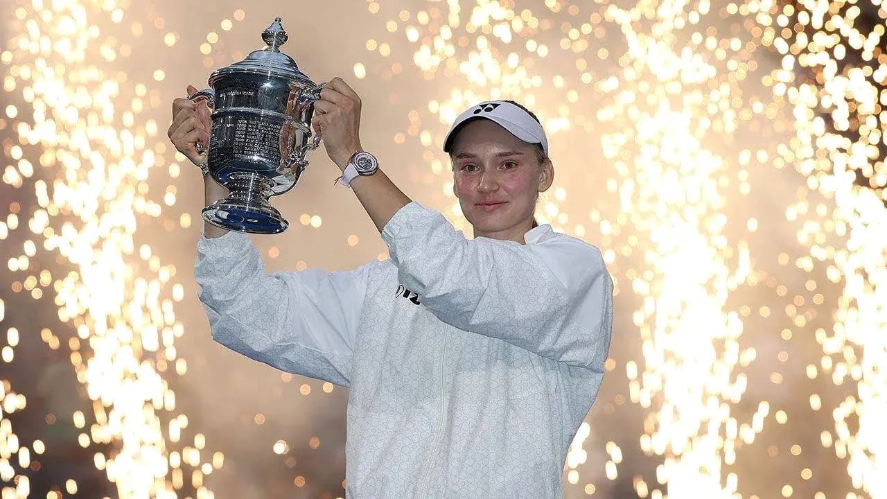 Player celebrating with trophy amidst fireworks