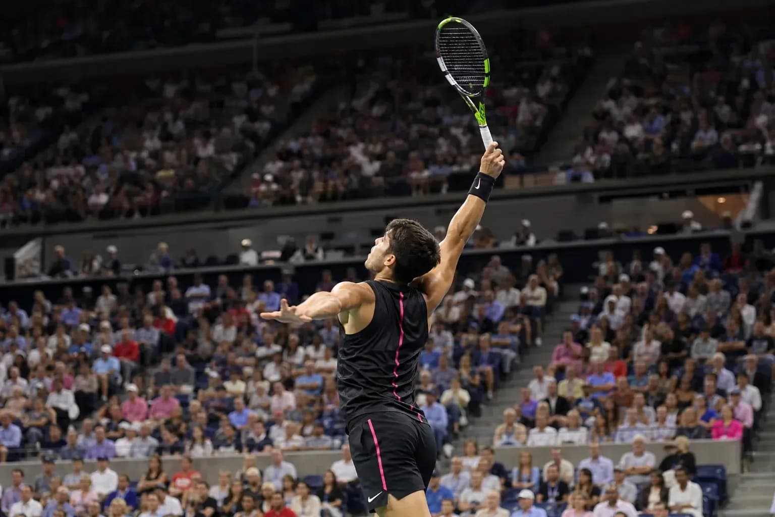 Player serving during a tennis match at stadium
