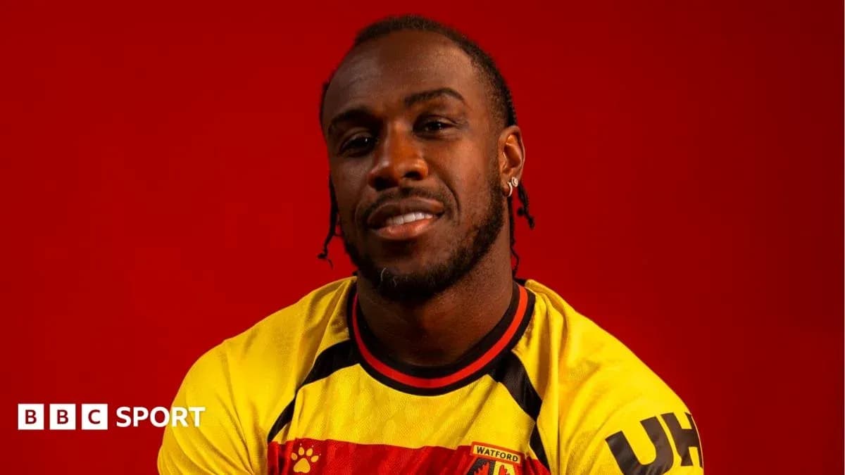 Player wearing Watford FC jersey against red background