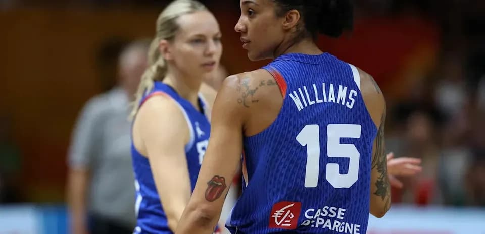 Two basketball players discussing during a game